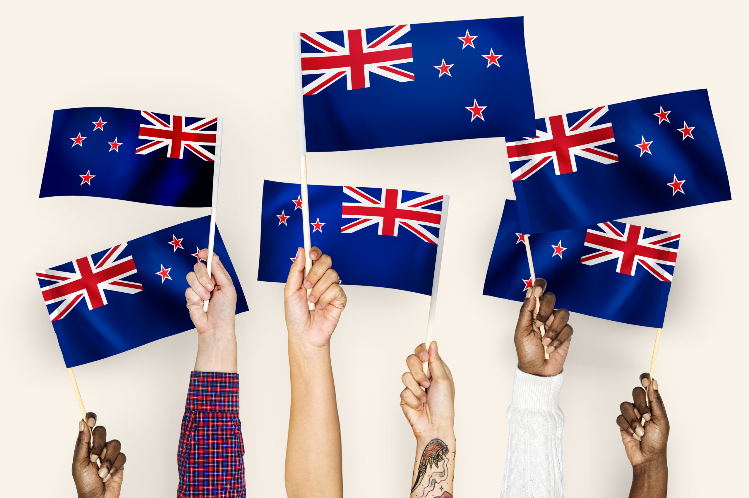 cropped-hands-waving-flags-new-zealand-scaled-1.jpg